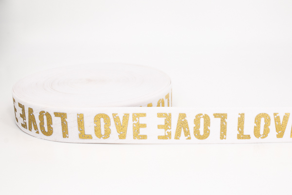 Picture of elastic webbing LOVE gold - 38mm wide - colour: white - 1m