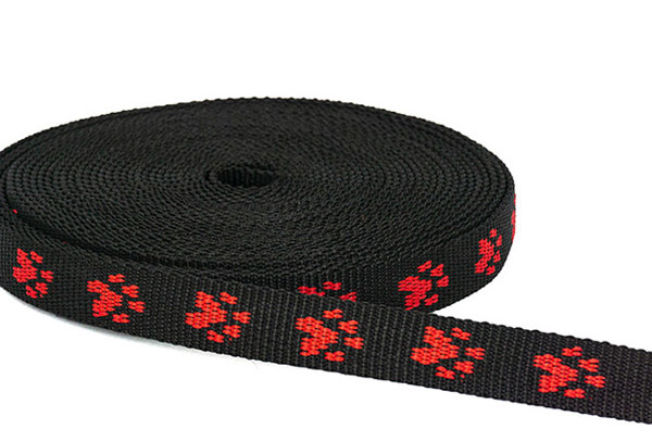 Picture of 20mm wide paw webbing - red paws on black webbing - 10m roll