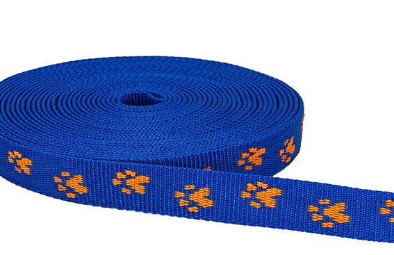 Picture of 20mm breites Pfötchengurtband, orange auf blau, 1m Rolle *ABVERKAUF*