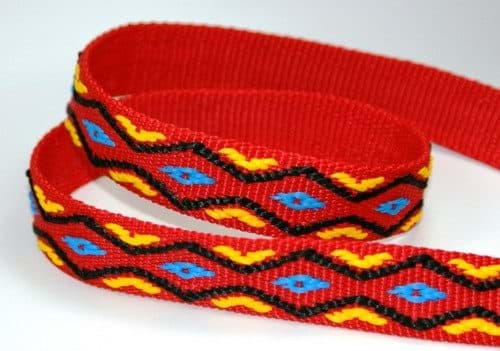 Picture of 50m roll 4-colored PP webbing - blue/yellow/black on red webbing - 25mm wide