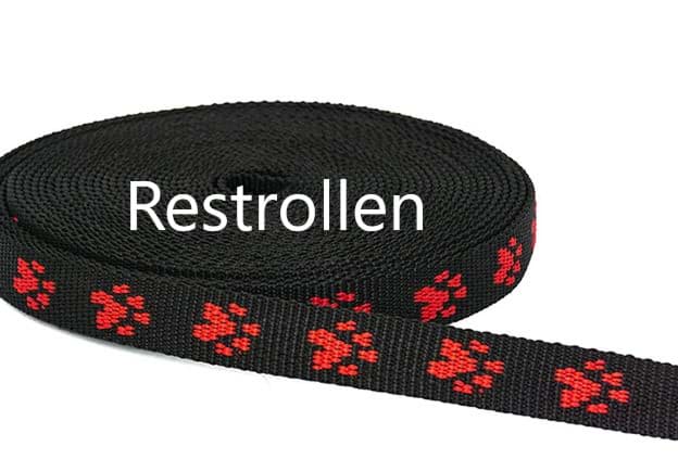Picture of 20mm wide paw webbing - red paws on black webbing - 1m roll